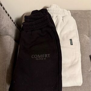 Two Comfrt sweatpants. One black and one cream/lgt grey. Both size XS
